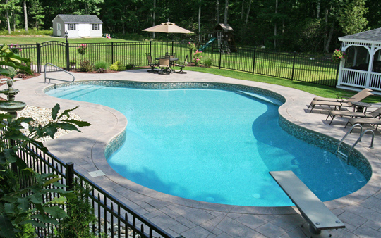 Decorative aluminum fencing installed around a finished outdoor project